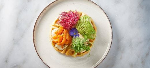 recipe image Βάφλα πατάτας με τυρί κρέμα και κάσιους  με yuzu σε ζύμωση, καρότο Σολωμού, αβοκάντο και ολλανδές, ξύσμα lime.