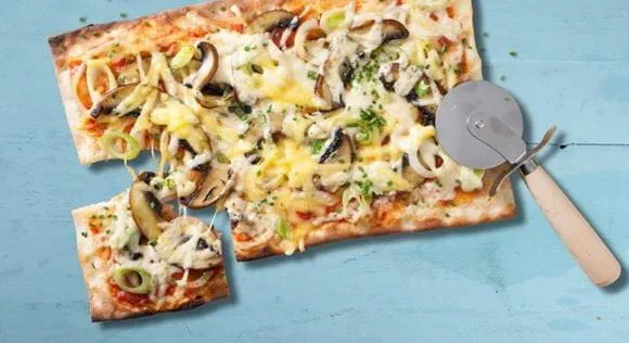 Vegan pizza made with Violife vegan plant based mozzarella cheese shreds 