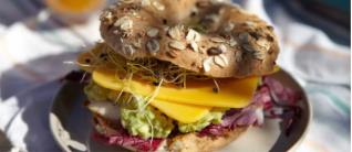A person holding a plate of fruit cake