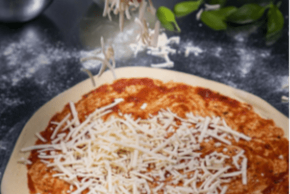 A person holding a plate of fruit cake